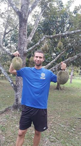 Greg holding puang manee durians
